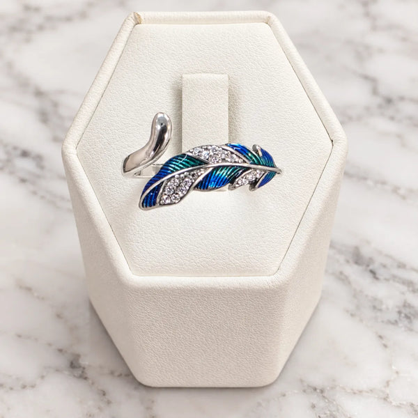 Anillo ajustable pluma azul microcircón