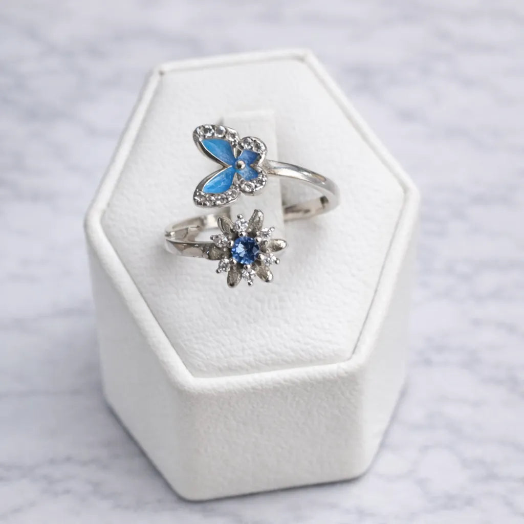 Anillo mariposa y flor circón azul ajustable