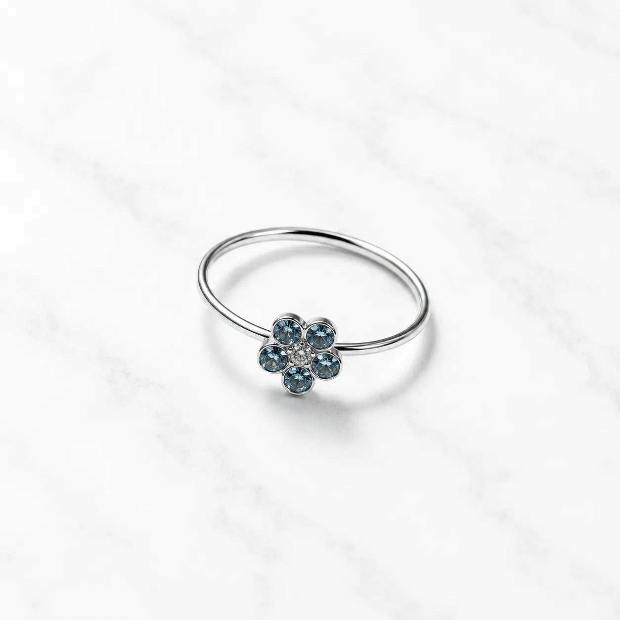 Argolla piercing nariz flor circón celeste
