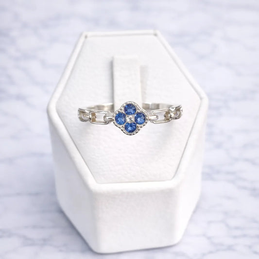 Anillo flor circón zafiro