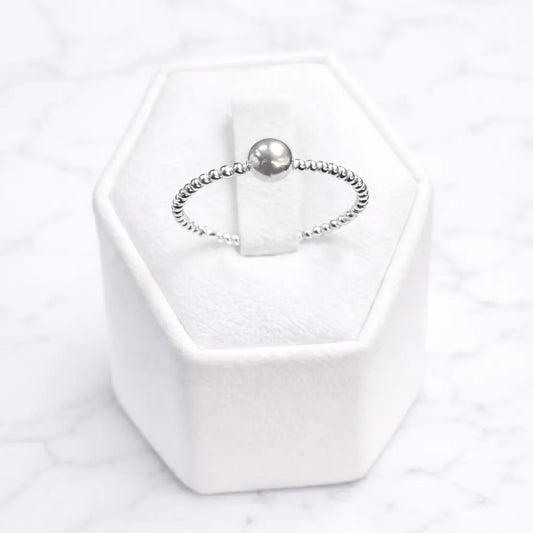 Anillo esfera con banda
