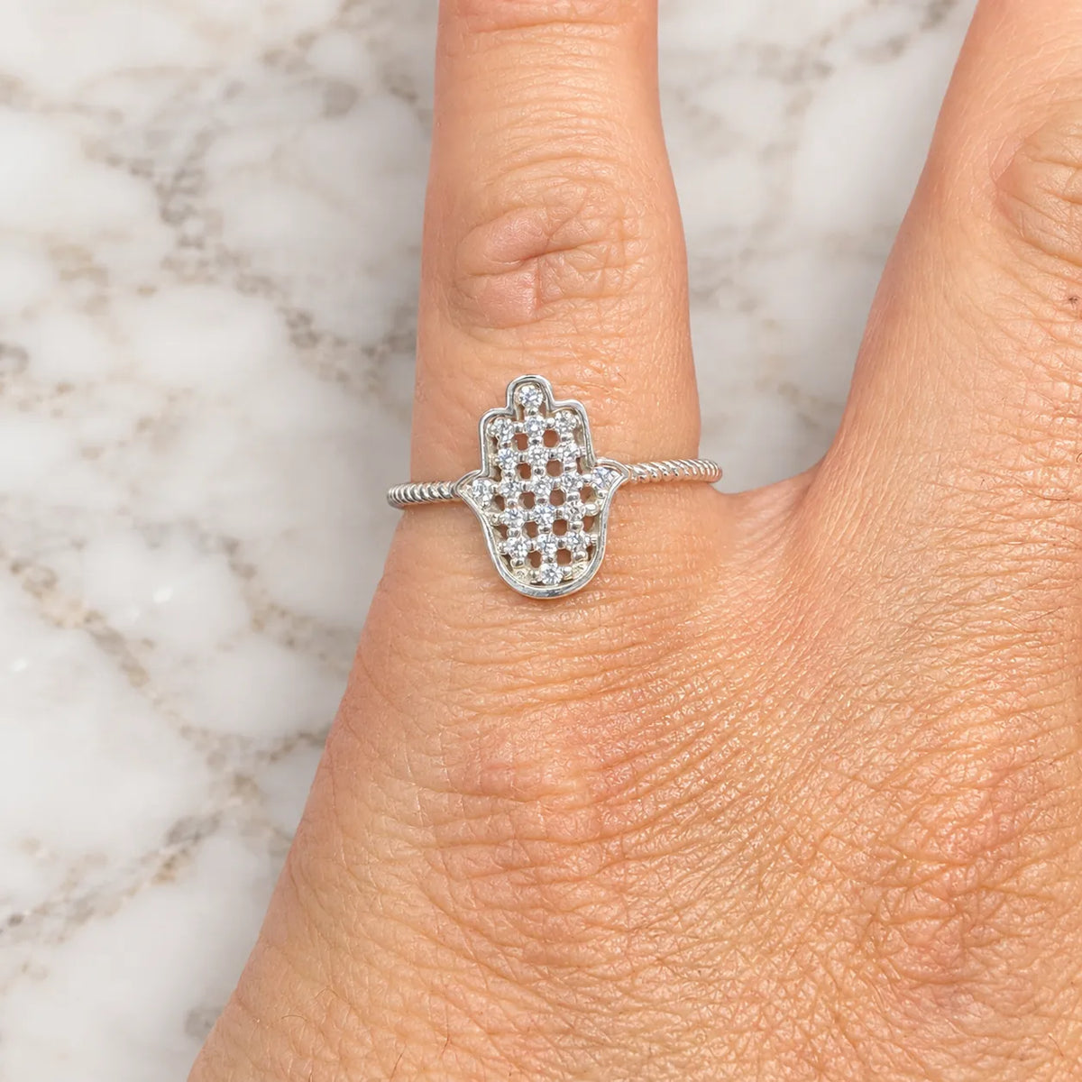 Anillo mano de fátima microcircón