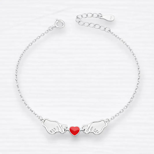 Pulsera manos corazón