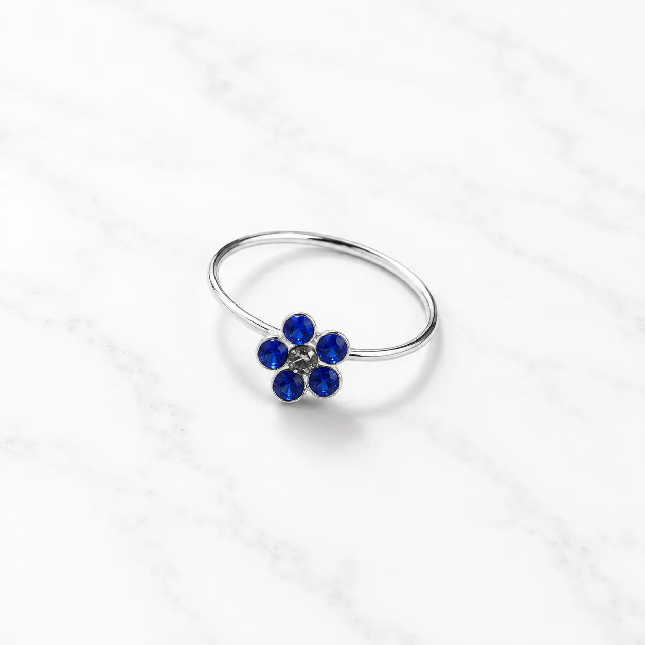 Argolla piercing nariz flor circón azul 10mm